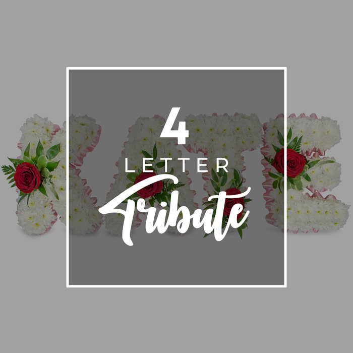 A calm, contemporary visual showcases a custom four-letter funeral flower tribute, reflecting the quiet dignity often sought by families arranging services in Mill Hill. The overall backdrop is a smooth, light grey field, free from distraction and chosen to let the flowers and central text breathe. Dominating the middle of the image is a square block of dark, semi-transparent grey, its edges neatly enclosed by a fine white border. On this central panel, the words 4 LETTER Tribute appear in white. The numeral 4 is bold and commanding at the top, LETTER follows in a simple, modern font, and Tribute is rendered below in a graceful script whose flowing loops suggest the gentle movement of trailing foliage. Because the central panel is translucent rather than fully solid, it allows glimpses of the floral artistry behind it: four substantial letters fashioned from a blanket of white chrysanthemums or similar delicate blooms. These small flowers are packed tightly together, creating a velvety, cushion-like texture that defines each letter's shape with clarity. Around the sides, a whisper of pale pink ribbon or fabric traces the contours, just visible where the flowers meet their base, offering a tender hint of colour and softness. Interspersed across the letters, deep red roses add moments of striking contrast, their rich tones standing out against the white. Each rose, with its spiral heart and layered petals, is supported by pockets of green foliage-likely fern or ruscus-introducing freshness and depth. The floral letters rest side by side, ready to spell a loved one's name or a meaningful word of farewell. The image quietly suggests bespoke sympathy flowers, handcrafted by Flowers Mill Hill for funerals, cremations, and remembrance services held in local churches or at nearby cemeteries and crematoria in North London.