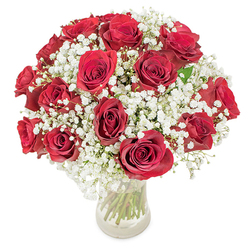 A luxurious gathering of vivid red roses interspersed with soft, frothy white baby's breath forms the heart of this classic bouquet, artfully arranged by the local florist team at Flowers Mill Hill. Each bloom radiates with fully opened, velvety petals, exuding passion and warmth amidst billows of gypsophila that bring airy lightness and contrast. The clear glass vase reveals a tangle of fresh green stems, echoing the natural beauty of Mill Hill's leafy avenues and historic parks. Set against a crisp white background and flooded with gentle, even light, the arrangement shimmers with vibrancy and care. As you imagine the subtle, intoxicating fragrance wafting from the petals, it's easy to see why this design is chosen for anniversaries and cherished moments in Mill Hill, Totteridge, or along Daws Lane. Perfect for hand delivery to loved ones or as a centerpiece for special celebrations, this bouquet marries artistry, tradition, and heartfelt emotion in every stem.