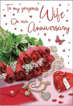 The anniversary card design appears like a private love letter turned into a still-life artwork, as if arranged on a coffee table in a Mill Hill flat just off Lawrence Street. A posy of crimson roses dominates the scene, each flower full and open, the petals swirling in tight, velvety curves that almost invite the fingertips to trace them. The roses lean slightly outward, seeming to spill from the frame toward the viewer, supported by airy sprigs of green foliage that add life and contrast. Scattered on the soft, romantic backdrop are thoughtful touches: a scarlet jewellery box tied with a delicate ribbon, suggesting a hidden surprise, and a golden necklace fashioned into intertwined hearts, gently looped so it catches the light in delicate arcs. Small sparkling decorations, shaped like hearts and tiny gems, are sprinkled across the surface, echoing the warmth of the occasion. The card's message is written in graceful, flowing script, positioned so that it appears to float among a cascade of miniature red hearts drifting upward like affectionate whispers. The lighting is warm and inviting, with a glow that softens edges and enhances the deep reds and gentle golds, giving the composition the atmosphere of a quiet anniversary evening at home after a stroll around Mill Hill Park. Every detail feels carefully balanced, the way an experienced florist might stage a bouquet and gifts for a special celebration. This image becomes a tribute to cherished anniversaries, shared journeys, and the promise of a future built on enduring devotion and everyday tenderness.