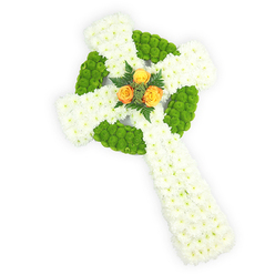 A carefully crafted floral Celtic cross, presented on a clean white backdrop and viewed from just above, that balances classic symbolism with contemporary restraint. The cross is predominantly formed of tight clusters of pristine white spray chrysanthemums whose small heads create an even, velvety surface conveying purity and quiet devotion. Set within that white are sections of bright, almost lime apple-green button chrysanthemums, placed to define the circular halo at the cross's intersection and to punctuate alternating bands along the arms; these green cushions add tactile interest and a luminous contrast that reads both modern and traditional. Nestled at the central meeting point is a small trio of orange-yellow roses, their petals unfolding in warm, sunlit tones that immediately draw the eye and lend a human softness to the geometric form. Around those roses, deep green fern tips or similar foliage give depth and frame the focal bloom with gentle shadow. The lighting is soft and deliberate, accentuating petal texture and the cross's relief while keeping the scene calm and respectful. This arrangement is presented with sympathy in mind-fitting for a funeral, memorial table, or chapel service-and its palette subtly echoes Irish colours, making it especially appropriate for families honouring Celtic roots. Locally, I imagine it placed with care by Mill Hill Broadway or brought to a service in Mill Hill Park, arranged by Flowers Mill Hill for families seeking a traditional yet quietly contemporary tribute.