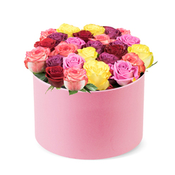 Imagine a plush, round pink hat box, its velvety surface catching a gentle studio glow as dozens of roses spill in a couture cascade. The color story unfurls like a living fabric: sunny yellow, bold crimson, deep burgundy, soft lilac, peach creams, and classic pinks, all nestled tightly with subtle bi-color petals weaving soft transitions from pink to cream. The roses are densely packed, creating a lush tapestry that feels modern and sophisticated, yet inviting enough to touch and admire. Each bloom appears flawless-smooth, cupped petals arranged with meticulous care-while a whisper of green leaves peeks between blossoms to frame the composition. There is a rose-and-citrus fragrance in the air, a hint of freshness that suggests a bouquet just cut and gently rested. The hat box itself adds a contemporary twist to a timeless gift, making this arrangement feel luxurious yet approachable-perfect for birthdays, romantic moments, or simply to brighten someone's day. For Mill Hill clients, this is a reliable option with same-day delivery across the area, ensuring the bouquet reaches its recipient with every petal pristine and every color vivid. The image is a testament to the craft of a seasoned florist-balanced, luxurious, and expressive-a signature moment from Flowers Mill Hill that speaks to our community's love of beauty and thoughtful gifting.