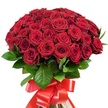 A strikingly elegant bouquet, composed of approximately fifty to sixty red roses, stands radiant against a spotless white backdrop, every bloom fresh and meticulously placed by local florists in Mill Hill. The roses, gathered tightly into a domed composition, reveal an array of plump, velvety petals in hues varying from deep garnet to classic crimson, their textures rich and enticing. Some flowers remain closed, hinting at enduring freshness, while others have burst open magnificently, displaying intricate, layered faces that seem to capture the light and warmth of a summer's day along The Ridgeway. Interwoven between the blooms, dark green, glossy leaves emerge, offering contrast, depth, and a reminder of the lush lawns and wooded spaces found nearby. The bouquet's stems are expertly wrapped in a broad, satin-textured red ribbon, tied into an opulent, flowing bow that adds a final flourish of celebration and romance. This carefully crafted arrangement evokes profound feeling and heartfelt emotion, perfect for grand declarations, memorable anniversaries, or any moment that demands a gesture of true affection. Delivered with the attention to detail and heartfelt enthusiasm that defines Mill Hill's finest flower shops, it's a living symbol of love's enduring beauty.