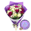 A vibrant graduation gift set is pictured against a bright white background, featuring a richly coloured bouquet paired with a themed balloon, much like one you might order from Flowers Mill Hill for a local celebration. The bouquet stands upright and is neatly wrapped in sumptuous purple paper that folds crisply around the stems and fans gently around the top, creating a smart, tailored silhouette. At the very base, the paper is drawn in and tied with a decorative green and white ribbon, which may carry a subtle pattern, lending the whole presentation a festive, almost ceremonial touch. Emerging from the wrap is a carefully balanced collection of flowers: creamy white roses, their petals tightly furled and spiralling, suggest poise and promise, while groups of deep fuchsia or magenta blossoms-likely carnations or chrysanthemums-bring a bold, saturated burst of colour. Their ruffled, many-layered petals create a plush texture, echoing the excitement and pride of graduation day. Tiny white filler flowers, similar to baby's breath, thread between the larger blooms, adding softness and a touch of airy lightness. Fresh green foliage, in various leaf shapes and shades, surrounds and supports the flowers, giving the bouquet depth and a natural rhythm reminiscent of the tree-lined avenues and gardens around Mill Hill Broadway. Resting to the lower right of the bouquet is a round purple Mylar balloon with a gentle metallic sheen. Its surface reflects the light, and across the centre, in flowing white script, the message To a Loving Graduate is clearly visible, transforming the arrangement into a specific tribute to academic success. Nearby, a small oval sticker or tag featuring green and white accents hints at the florist's brand or quality mark. Together, the bouquet and balloon radiate warmth, pride, and encouragement, ideal for celebrating exam results, university graduations, or new professional qualifications for graduates throughout Mill Hill.