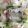 This vibrant Florist Choice Bouquet unfolds with the confident opulence you expect from a Mill Hill specialist. White roses anchor the arrangement, their petals in varying stages of bloom catching the light with a satin-soft sheen. Nestled among them are pristine white lilies, their broad petals opening to reveal inner tones touched with a hint of pink, a delicate warmth set against the cool white. Subtle splashes of smaller pink blossoms drift through the composition, while clusters of soft green foliage-eucalyptus-like in texture-add air and depth, giving the bouquet a natural, garden-fresh feel. The bouquet fills the frame, a statement of abundance balanced by refined restraint, as if crafted by a seasoned florist who knows how to pair luxury with everyday sweetness. An immaculately clean white overlay sits over the florals, bordered by a slender line, presenting the product name Florist Choice Bouquet in two fonts: Florist in an elegant script and CHOICE BOUQUET in a bold uppercase sans serif, with a large, white ?300 lingering beneath. Designed as a premium gift, it suits anniversaries, birthdays, or a heartfelt gesture that deserves a touch of celebration. The image radiates a soft, inviting glow, suggesting soft morning light on a satin surface, and it speaks of the care and craftsmanship behind a high-end bouquet. For Mill Hill customers, this is more than a pretty image-it's a promise of fresh stems, careful handling, and reliable delivery across NW7, so the blooms arrive vibrant, fragrant, and ready to brighten a home or office. Flowers Mill Hill stands behind this elegant selection, ready to bring a moment of joy to the local community.