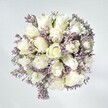 Like the start of a calm day in Mill Hill, this bouquet radiates effortless elegance. At the heart, pristine white roses bloom in plush, layered spirals, symbolising new beginnings and quiet celebration-much like the joy found at a family gathering on Mill Hill's Ridgeway. Threaded delicately between each rose are soft sprays of lavender statice, their pale blossoms adding a subtle, lace-like texture that hints at comforting memories and heartfelt confidences. Surrounded by a gentle, white-washed backdrop and illuminated by natural light, every petal appears freshly picked and luminous, reminiscent of an open a window to a sun-drenched NW7 morning. This arrangement is ideal for sharing solace, purity, or a message of congratulations, crafted for those moments that linger in memory-whether sent as a comforting gesture across Mill Hill or displayed as a peaceful centrepiece at home. Its quiet beauty and soothing fragrance invite pause, reflection, and appreciation for life's gentle milestones.