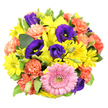 Presented on a bright white background and viewed from directly above, this circular bouquet appears like a carefully composed floral mandala, full of joyful colour and intricate detail. A prominent pink gerbera daisy sits just off the central point toward the lower part of the arrangement, its orderly ring of petals forming a soft halo around a textured, greenish-yellow eye that subtly draws the gaze inward. Radiating around it, clusters of lively yellow chrysanthemum daisies brighten the composition, their slender, slightly curved petals reaching outward like little shafts of sunshine over Mill Hill Broadway on a clear day. Interwoven through these sunny blooms are deep purple lisianthus, their velvety, cup-shaped flowers providing a rich, cool counterpoint, with some blossoms fully open and others still poised in elegant buds, hinting at further flowering to come. Coral-orange carnations punctuate the design, their frilly, many-layered petals adding a playful softness and a sense of gentle movement, almost like fluttering fabric. Threads of glossy green foliage and a few variegated leaves with creamy margins frame and separate the flowers, giving the bouquet structure and the natural feel of a freshly picked garden posy from a Mill Hill back garden. The light is bright, neutral, and evenly spread, making each colour-soft pink, radiant yellow, deep purple, and warm coral-appear vivid yet harmonious. The overall mood of the arrangement is festive, warm, and full of positive energy, making it ideal for birthdays, housewarmings, or thoughtful thank-you gestures to neighbours and loved ones across Mill Hill, Mill Hill East, or nearby Finchley. It clearly reflects the careful hand and imaginative eye of an experienced North London florist.