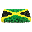 The photograph captures a beautifully crafted rectangular floral panel, created in the bold green, gold, and black of the Jamaican flag, and set against a bright white background that emphasises its strong lines and colours. The tribute is built with clear thickness, like a floral plaque, its edges neat and squared, suggesting it is ready to be displayed at a funeral service in Mill Hill, Totteridge, or nearby Barnet. Across the centre, a vivid golden-yellow X extends from corner to corner, forming the familiar diagonal cross of the flag. This saltire is made from numerous ruffled yellow blooms, each petal slightly curled to create a soft, cushioned effect that seems almost touchable. The four resulting triangles are cleanly defined. The top and bottom triangles are filled with dense green flowers, laid so closely together that the surface looks like a freshly trimmed lawn after rain, rich and velvety. On the left and right, striking black petals are massed into smooth, matte triangles, giving visual weight and a quiet, respectful tone that's fitting for a sympathy tribute. The boundaries between colours are sharp and controlled, revealing the care taken in placing each stem. The lighting is even and bright, allowing the different textures to stand out - from the almost moss-like green to the satin softness of the black and the cheerful brightness of the yellow. Overall, this Jamaican-themed floral arrangement conveys pride in heritage, love for the person being honoured, and the comforting craftsmanship of a skilled local florist creating a meaningful goodbye.