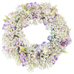 A softly coloured funeral wreath is presented on a stark white background, so that its gentle circular form and intricate blooms can be fully sensed. The wreath is built from an abundance of Baby's Breath, layered so thoroughly that their tiny white flowers merge into a continuous ring, like a band of pale, floating cloud. Nestled throughout this airy cushion are lisianthus blooms, each one introducing a graceful note of structure and colour. The lisianthus petals are satin-smooth and delicately ruffled, starting from a core of pristine white and gradually deepening to purple-violet along the edges, with some petals showing only a whisper of lavender and others a more pronounced, rich hue. A mixture of fully opened blossoms and tightly held buds creates a natural, living rhythm; the buds, slender and tinged with pale green and cream, stand as quiet symbols of unfolding memories. The flowers are carefully spaced around the ring so that the purple accents circulate gently, never overpowering the restful white. With no foliage or additional decoration, the focus rests entirely on this interplay between the mist-like Baby's Breath and the fluid lines of the lisianthus. The open centre of the wreath lends it the timeless symbolism of eternity and unbroken love, making it an especially fitting tribute for a funeral, cremation, or memorial service in Mill Hill's churches or community spaces. One can imagine this wreath being delivered to a family home near Mill Hill Park or Mill Hill East, offering a calm, dignified presence. The arrangement communicates sympathy and solace through its harmonious colours and thoughtful, handcrafted design.