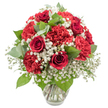 A lavish bouquet of red and white flowers is displayed in a clear glass vase, captured against a bright white background that accentuates every hue and texture. The central stars of the arrangement are deep red roses, their velvety petals curling in tight, elegant spirals, each bloom exuding a sense of classic romance and sincerity. Surrounding the roses are generous clusters of red carnations, their frilled petals layered in soft, undulating waves that create a rich, almost cushion-like texture and give the bouquet its luxuriant, full appearance. Woven between the bold reds, white baby's breath appears as a fine, airy mist of tiny blossoms, softening the palette and lending the whole design a light, almost ethereal charm. Carefully placed among the flowers are dark green leaves and rounded eucalyptus stems, their cool, silvery-green tones adding depth, contrast, and a whisper of natural fragrance, reminiscent of a quiet walk through the green spaces of Mill Hill. The overall shape of the bouquet is a rounded dome, balanced and symmetrical, ideal for sitting on a sideboard in a Mill Hill home or gracing a restaurant table near the Broadway. The transparent vase, with its simple, slightly flared rim, keeps attention on the flowers while revealing the neatly cut stems and clear water inside, evidence of their freshness. The mood is warmly romantic and slightly festive, making this arrangement perfect for Valentine's Day, anniversaries, engagements, or simply sending a loving message across Mill Hill with the timeless beauty of red roses, red carnations, and white baby's breath.