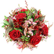 Seen from directly overhead, this bouquet forms a beautifully rounded cluster of flowers and foliage, set against a bright white backdrop that highlights its rich colours and varied textures. Deep crimson red roses sit at the heart of the design, their velvety petals unfurled in tight, elegant spirals that signal timeless love and devotion. Between these luxurious blooms, airy sprays of pale pink waxflowers weave through, each tiny star-shaped blossom with a soft yellow centre adding a whisper of delicacy and an almost lace-like detail to the arrangement. A broad base of lush green foliage surrounds and supports the flowers, with different shapes and finishes-some leaves smooth and glossy, others more softly textured-contributing to a sense of depth and fullness. Punctuating the greenery, burgundy and bronze-toned leaves with subtle reddish-brown veining bring in a touch of modern sophistication and a hint of autumnal warmth, recalling the gentle shifts of colour around Mill Hill's tree-lined streets and nearby green spaces. Tucked among the roses and waxflowers, smaller deep red blooms, reminiscent of alstroemeria or another bell-shaped variety, create further layers of crimson and add visual rhythm. At the edge of the bouquet, a glimpse of red and white patterned tag or ribbon can be seen, hinting that this arrangement is finished and ready for gifting, perhaps on its way to a doorstep near Mill Hill Broadway or the quieter residential lanes off Hale Lane. The overall mood is one of generous elegance and intimate celebration, a bouquet that feels perfect for anniversaries, Valentine's Day, or any moment when someone in Mill Hill wishes to express deep affection with fresh, beautifully arranged flowers.