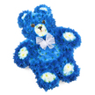 A tender floral teddy bear, carefully shaped from fresh blooms, rests against a bright white background, its serene design perfectly suited to a quiet farewell in Mill Hill or a memorial gathering near Mill Hill Broadway. The bear's rounded body is entirely coated in compact clusters of royal blue flowers, probably chrysanthemums or similar small-headed blooms, arranged so close together that they form a smooth, plush-looking surface that calls to mind the fur of a much-loved soft toy. The blue petals create a consistent, vivid colour field, with subtle variations in shade where light and shadow model the curves of the tummy, head, and limbs. Creamy white flowers, some with the faintest yellow tint at their centres, highlight the subtle muzzle, soften the inner cups of the ears, and define the neat oval pads on each of the four paws, adding balance and visual tenderness. The teddy's face is simple yet moving: two round, glossy eyes in deep brown or amber, a small black triangle nose, and a fine curved line suggesting a gentle smile give the figure a companionable, comforting presence. Around the neck, a sheer white organza-style bow is tied with care, its delicate, ruffled edges and translucent texture providing a light, almost angelic flourish. The bear is positioned at a slight diagonal, lending a sense of resting ease and naturalness to the composition. Crafted with precision by local florists, this floral teddy is especially fitting as a sympathy arrangement for a baby boy, a child's funeral tribute, or a commemorative piece for someone young at heart in the Mill Hill community, where flowers often speak the words that feel too tender to say aloud.