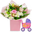 This image shows a joyful new baby girl arrangement set against a crisp white background, giving it a bright, airy feel. In the centre stands a sturdy, square gift box in soft light pink, perfectly coordinated with the occasion. From it rises a lush bouquet, the stems wrapped in delicate pink tissue paper and clear cellophane that catches the light with a slight sheen. At its heart, a bright pink gerbera daisy opens wide, its even circle of petals framing a darker centre, immediately drawing the eye. Around this focal bloom, plump white chrysanthemums cluster together, their layers of fine petals creating a pillowy softness. Slender alstroemeria lilies in white and blush-pink, gently speckled at their throats, arc through the arrangement, adding grace and movement. Just above, a creamy yellow lily bud points upward, still closed and full of promise. Dotted throughout are vivid lime-green button-like flowers, their compact, textured heads standing out against the lighter tones. Small sprays of deep red hypericum berries thread between the blooms, set against a wealth of dark-green leaves and feathery fern fronds that spill casually over the edge of the pink box, giving the bouquet a fresh-from-the-garden look. To the right of the flowers, a metallic foil balloon shaped like a classic baby stroller adds a playful note. It shines in bright pink, with a rounded purple hood and purple wheels patterned with colourful spokes. Across its side, bold yellow and green letters joyfully spell out It's a Girl!, accompanied by tiny pink hearts. The whole composition feels like a tender celebration waiting on a kitchen table in Mill Hill, ready to be taken to proud new parents near Mill Hill Park or along Bittacy Hill.